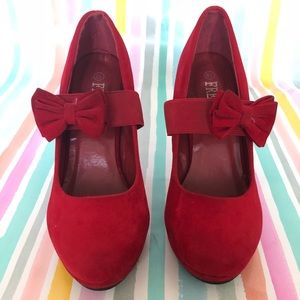 Red velvet heels with bow strap